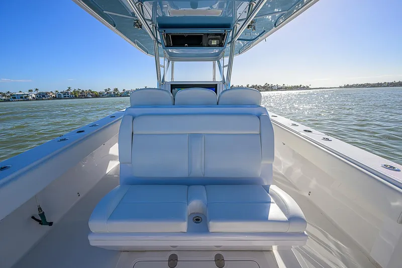 Mare Yacht Photos Pics 2019 Bahama 41 boat with white seating, cruising on a sunny day.
