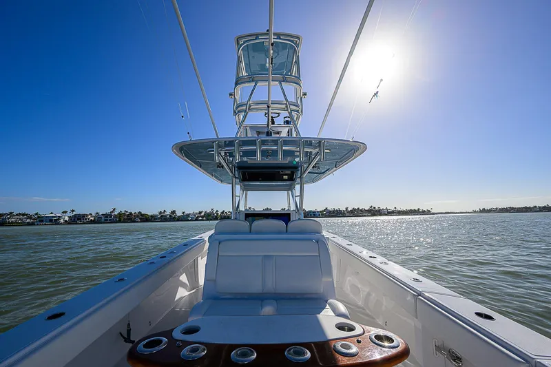 Mare Yacht Photos Pics 2019 Bahama 41 boat on water, sunny day, clear blue sky, luxury seating.