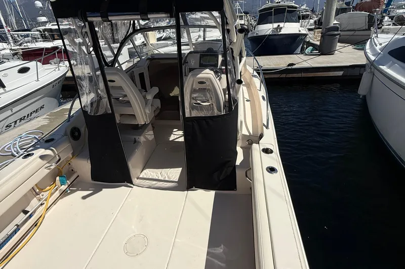  Yacht Photos Pics 2023 Grady-White Adventure 218 boat docked at marina, interior view.