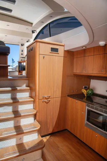 Yoda Yacht Photos Pics Luxurious interior of 2008 Sunseeker Predator 62 yacht with wooden cabinetry and modern kitchen.