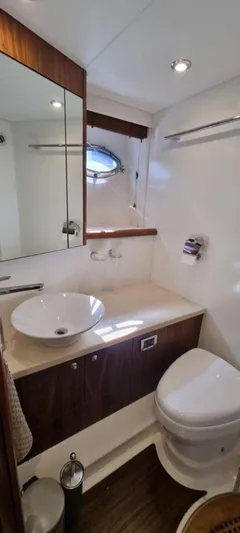 Yoda Yacht Photos Pics Luxurious bathroom in 2008 Sunseeker Predator 62 yacht with modern fixtures and elegant design.