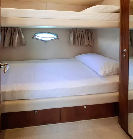 Yoda Yacht Photos Pics Bunk beds in 2008 Sunseeker Predator 62 yacht cabin with porthole window.