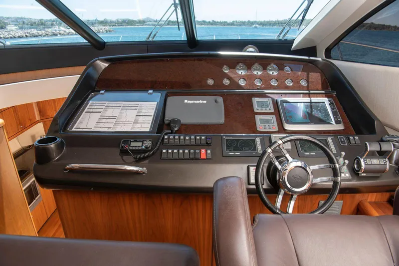 Yoda Yacht Photos Pics 2008 Sunseeker Predator 62 yacht helm with navigation controls and steering wheel.