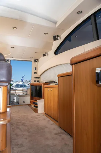 Yoda Yacht Photos Pics Interior of 2008 Sunseeker Predator 62 yacht with modern wood cabinetry and plush carpeting.