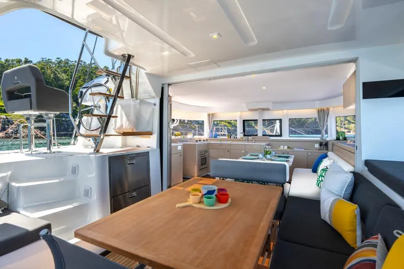  Yacht Photos Pics Luxurious interior of 2024 Lagoon 43 yacht with modern dining and seating area.