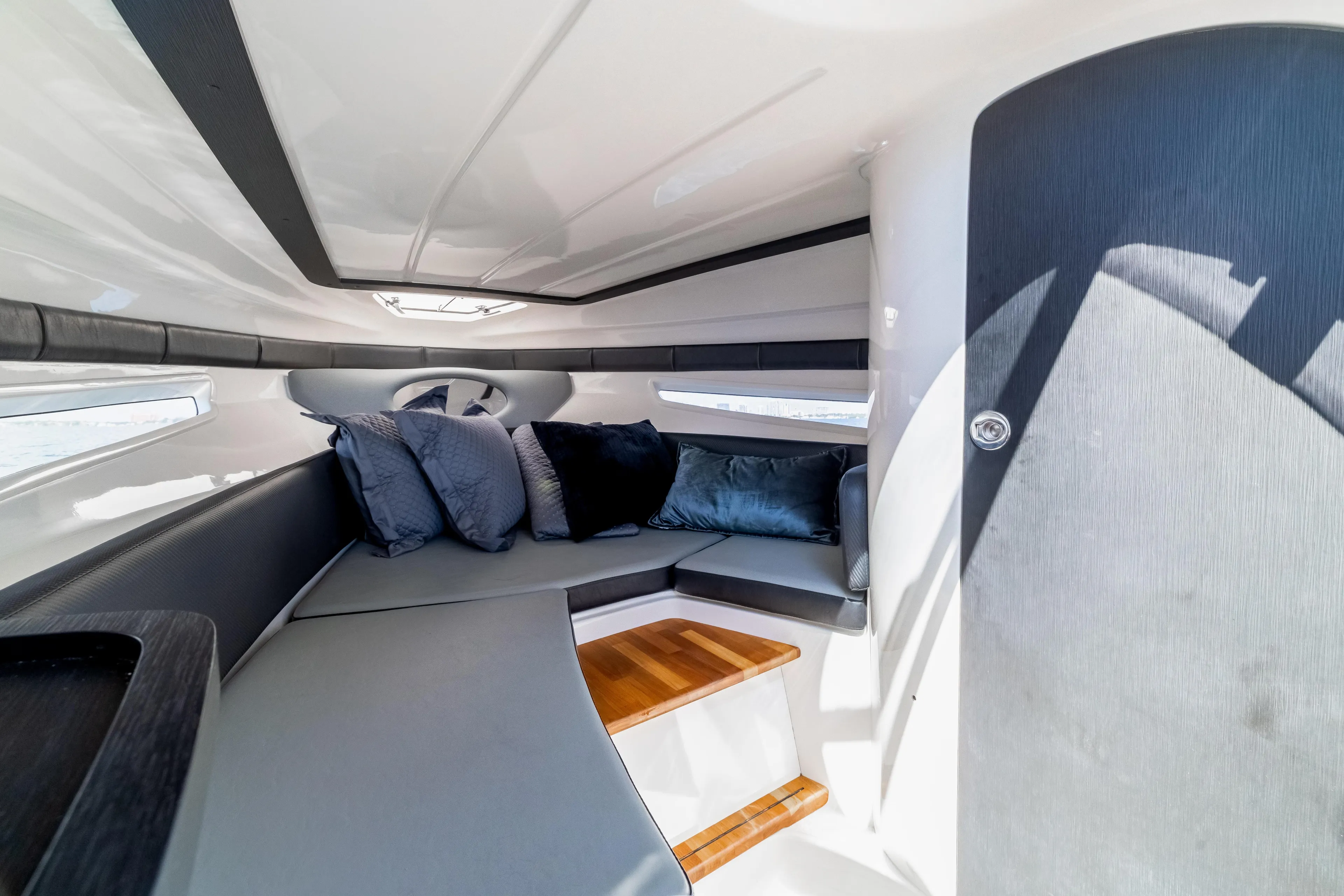  Yacht Photos Pics Luxurious interior of 2025 Hanover 305 boat with plush seating and modern design.