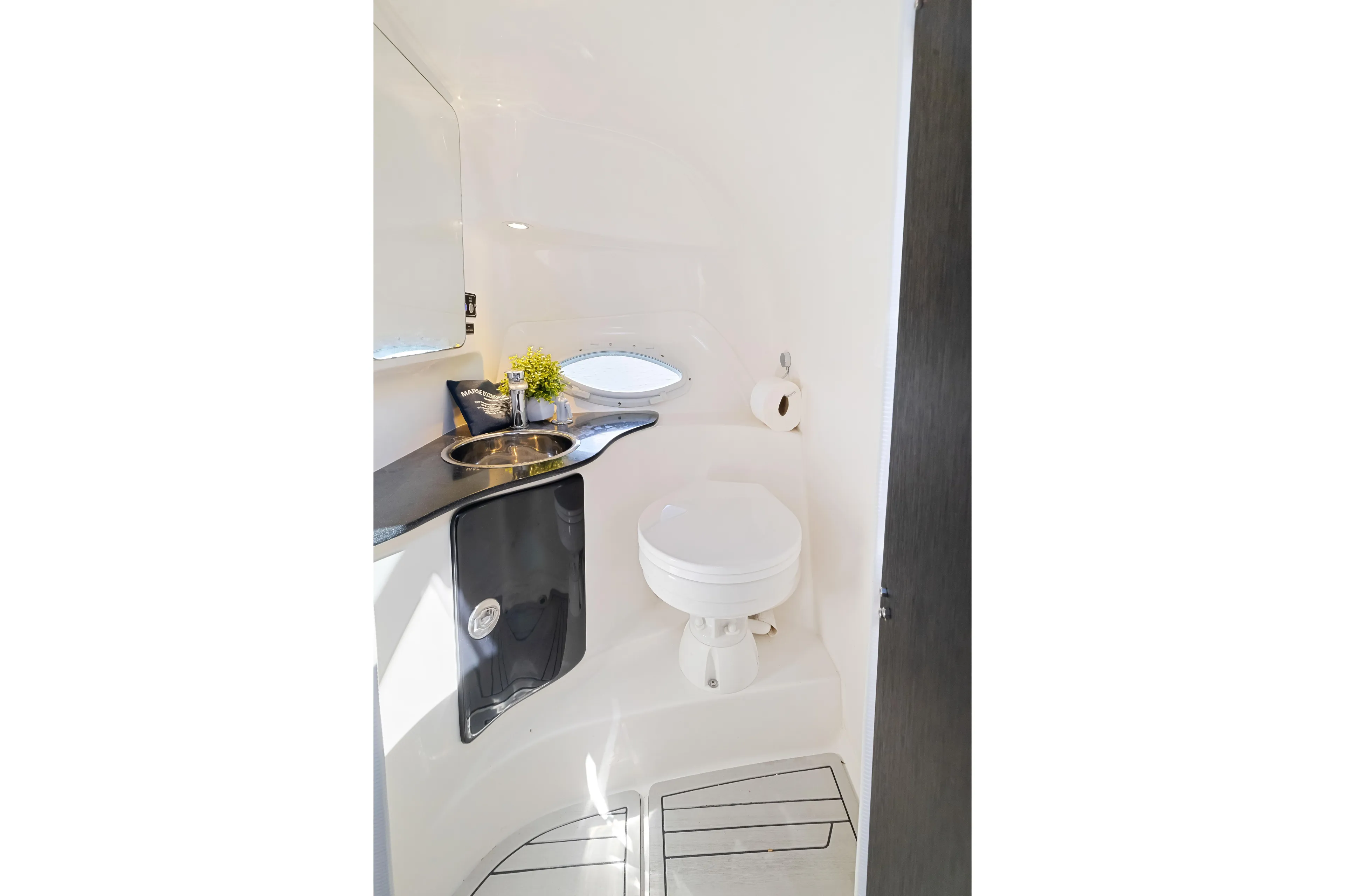  Yacht Photos Pics Modern bathroom interior in 2025 Hanover 305 model, featuring sleek design and compact amenities.