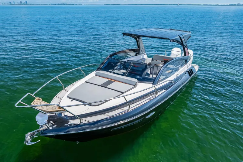  Yacht Photos Pics Luxurious 2025 Hanover 305 boat cruising on clear blue waters.