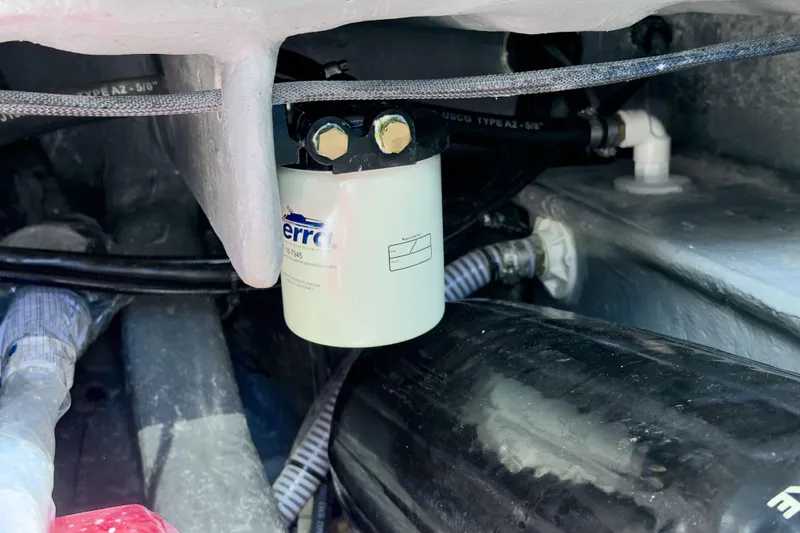  Yacht Photos Pics Engine compartment of a 2025 Hanover 305 with visible fuel filter and hoses.