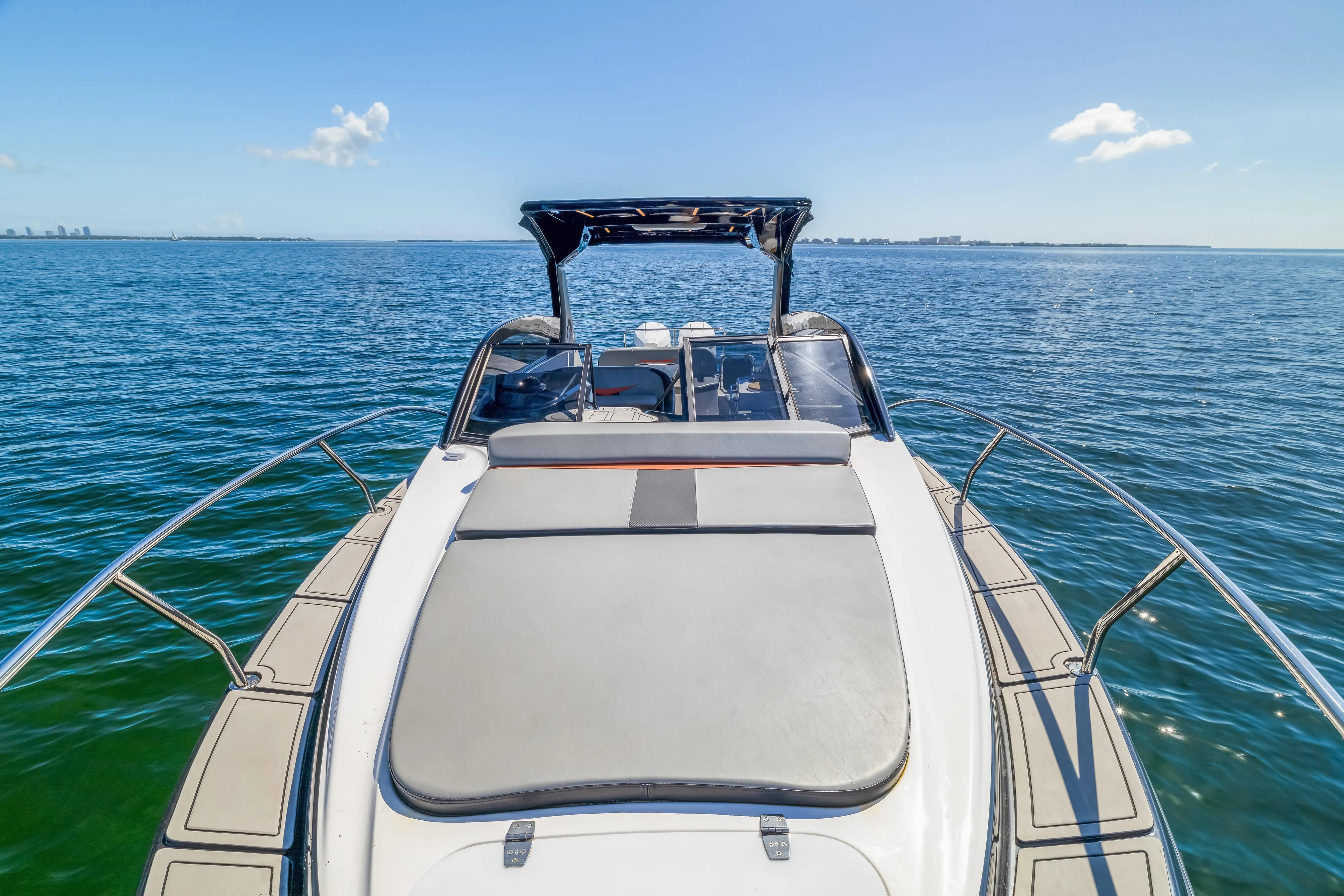  Yacht Photos Pics Luxury Hanover 305 boat cruising on open water, 2025 model, clear blue sky.