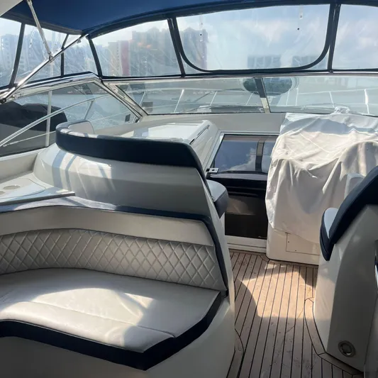  Yacht Photos Pics Interior of 2003 Sunseeker Portofino 46 yacht with luxurious seating and helm.
