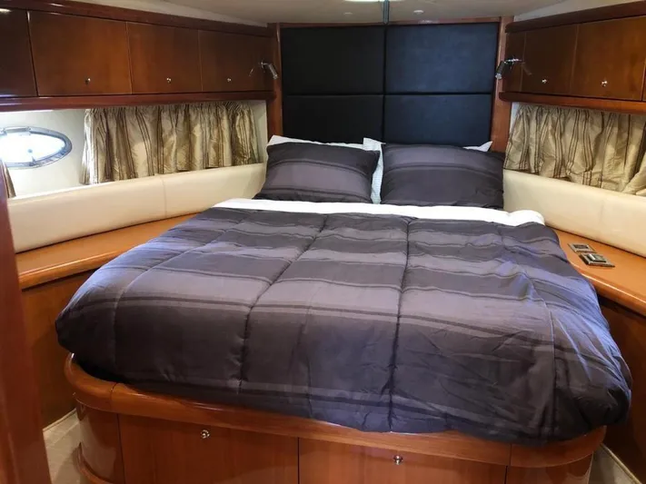  Yacht Photos Pics Luxurious cabin interior of 2003 Sunseeker Portofino 46 yacht with cozy bedding.
