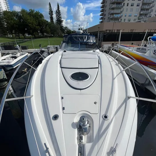  Yacht Photos Pics 2003 Sunseeker Portofino 46 yacht docked, showcasing sleek design and spacious deck.