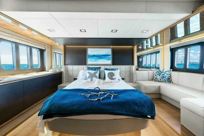 Mama's House Yacht Photos Pics Luxurious bedroom interior on 2018 Absolute 60 Flybridge yacht with ocean views.