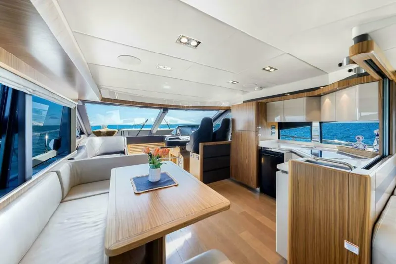Mama's House Yacht Photos Pics Luxurious interior of 2018 Absolute 60 Flybridge yacht with modern design and ocean views.