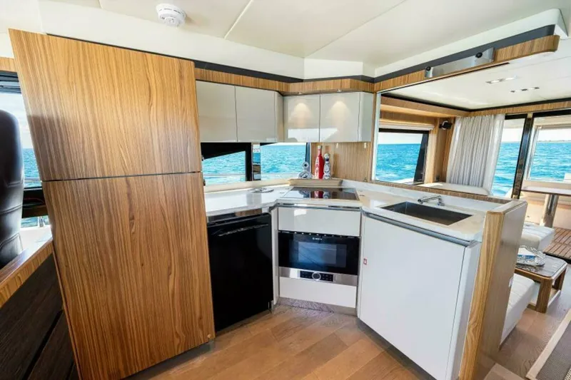 Mama's House Yacht Photos Pics Luxurious kitchen interior of 2018 Absolute 60 Flybridge yacht with ocean view.