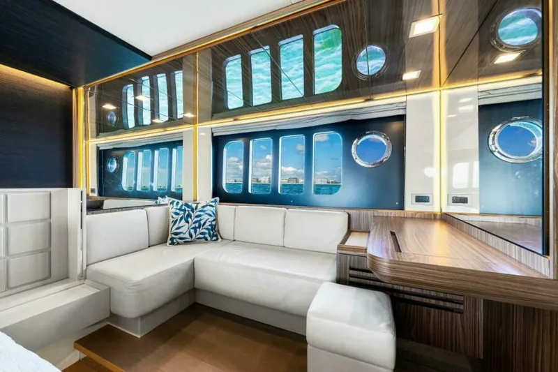 Mama's House Yacht Photos Pics Luxurious interior of 2018 Absolute 60 Flybridge yacht with elegant seating and ocean view.