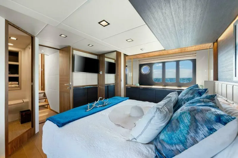 Mama's House Yacht Photos Pics Luxurious bedroom interior of 2018 Absolute 60 Flybridge yacht with ocean view.