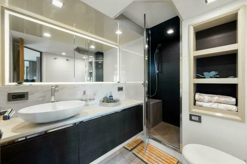 Mama's House Yacht Photos Pics Luxurious bathroom in 2018 Absolute 60 Flybridge yacht with modern fixtures and elegant design.
