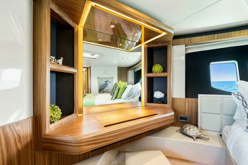 Mama's House Yacht Photos Pics Luxurious interior of 2018 Absolute 60 Flybridge yacht with elegant wood finishes.