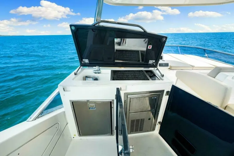 Mama's House Yacht Photos Pics Flybridge kitchen on 2018 Absolute 60 yacht with ocean view.