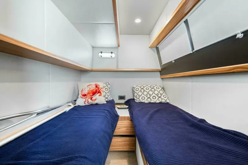 Mama's House Yacht Photos Pics Cabin interior of 2018 Absolute 60 Flybridge yacht with twin beds and modern decor.