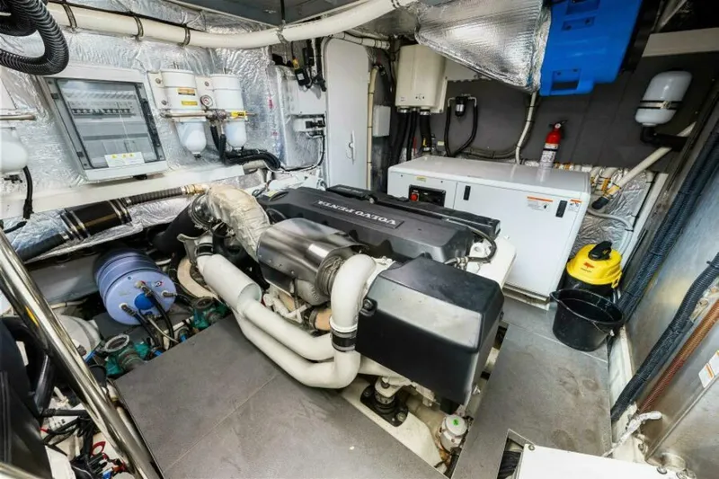 Mama's House Yacht Photos Pics Engine room of 2018 Absolute 60 Flybridge yacht, featuring Volvo Penta engine and equipment.