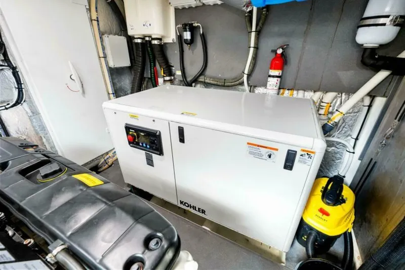 Mama's House Yacht Photos Pics Engine room of 2018 Absolute 60 Flybridge yacht with Kohler generator and equipment.