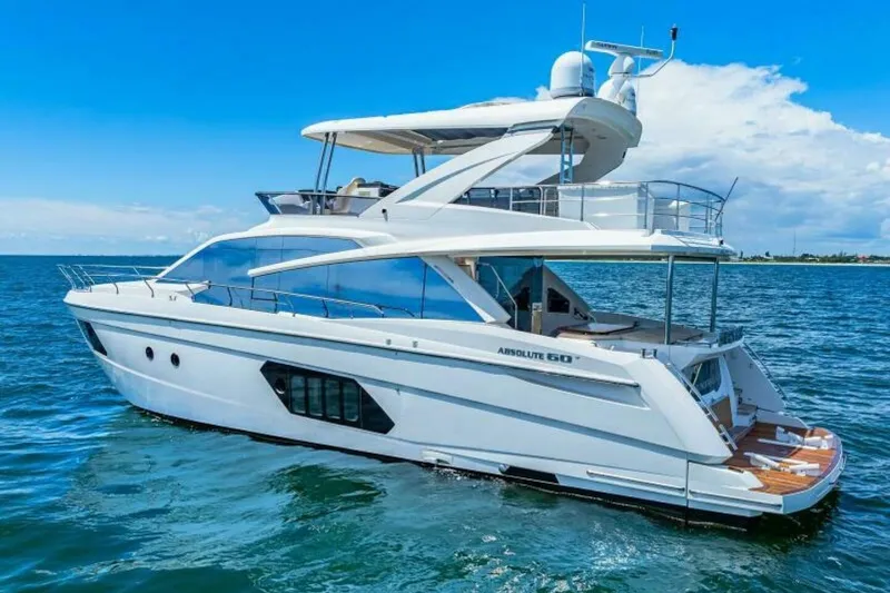 Mama's House Yacht Photos Pics 2018 Absolute 60 Flybridge yacht cruising on open water under a clear blue sky.