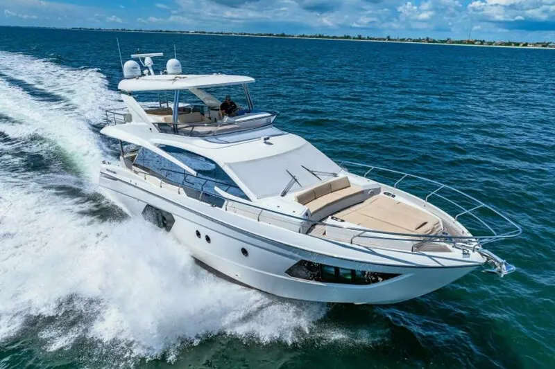 Mama's House Yacht Photos Pics 2018 Absolute 60 Flybridge yacht cruising on open water.