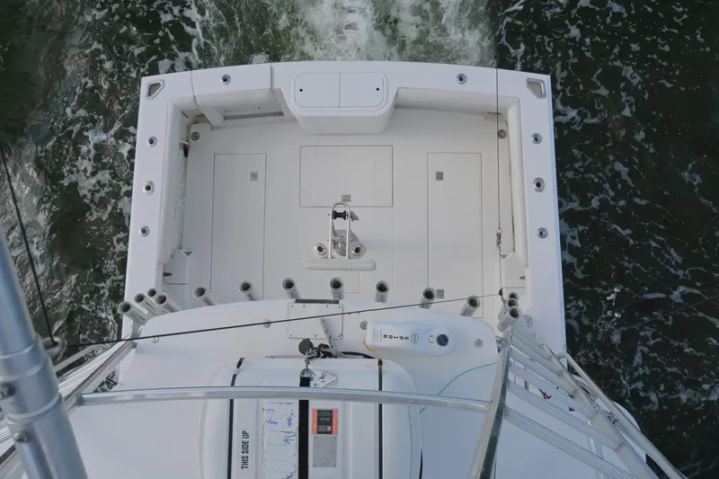 Done Deal Yacht Photos Pics Overhead view of 2001 Cabo 35 Express boat deck on water.