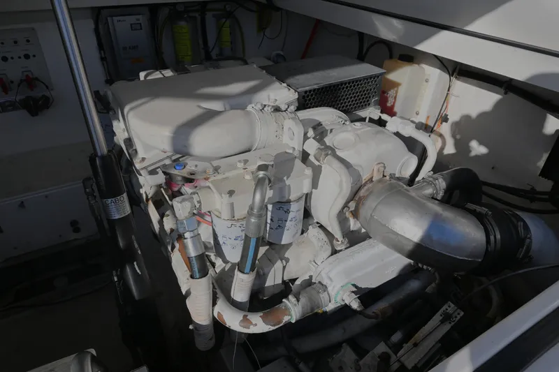Done Deal Yacht Photos Pics Engine compartment of a 2001 Cabo 35 Express boat, showcasing mechanical components.