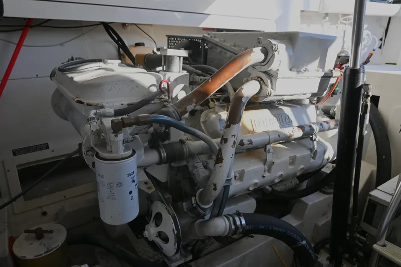 Done Deal Yacht Photos Pics Engine compartment of a 2001 Cabo 35 Express boat, showcasing mechanical components.
