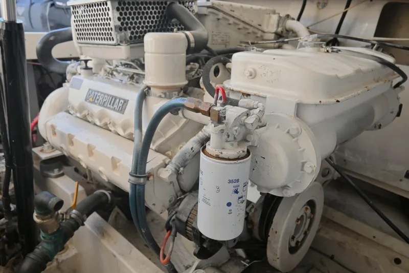 Done Deal Yacht Photos Pics Engine of a 2001 Cabo 35 Express boat, featuring a Caterpillar component.