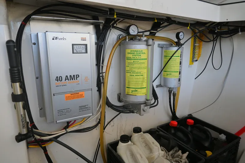 Done Deal Yacht Photos Pics 2001 Cabo 35 Express engine room with battery charger and hydraulic control system.