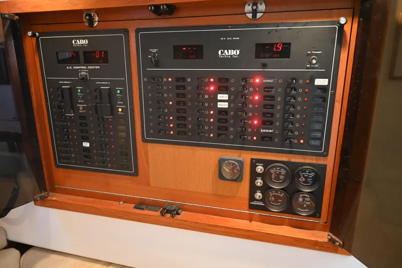 Done Deal Yacht Photos Pics Electrical control panel on a 2001 Cabo 35 Express yacht, featuring gauges and switches.