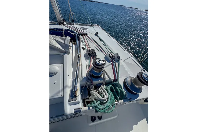 Liberty Yacht Photos Pics Deck of 2005 Lagoon 440 sailboat with ropes and winches, overlooking the sea.