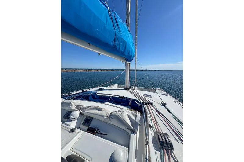 Liberty Yacht Photos Pics Sailing on a 2005 Lagoon 440 catamaran with blue sails on a sunny day.