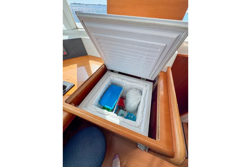 Liberty Yacht Photos Pics Built-in freezer on 2005 Lagoon 440 yacht, open with contents visible.