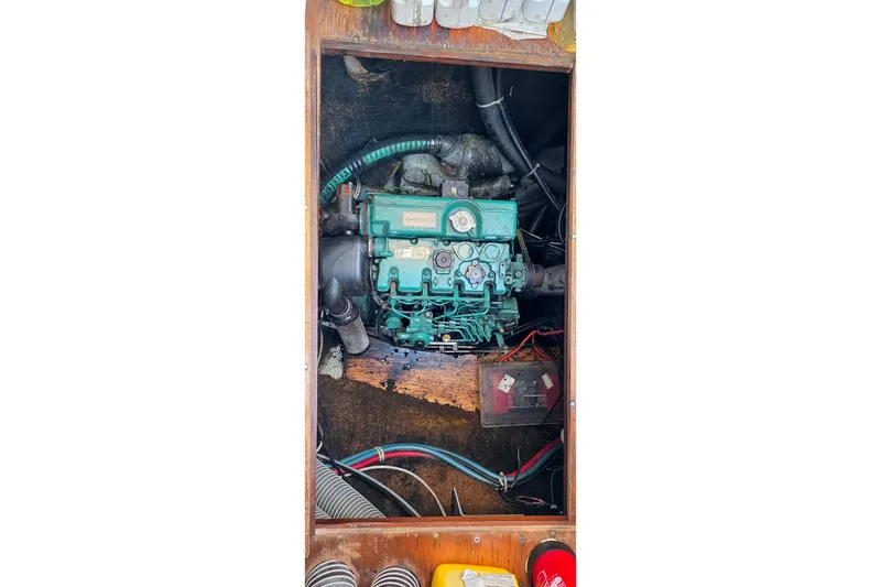 Liberty Yacht Photos Pics Engine compartment of a 2005 Lagoon 440 catamaran, featuring visible wiring and components.