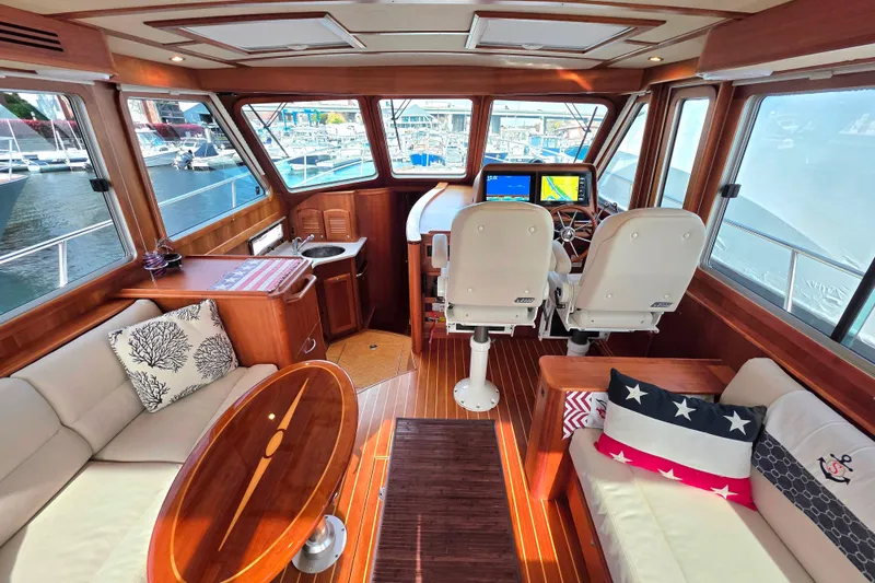  Yacht Photos Pics Luxurious 2017 Sabre 42 Salon Express interior with helm, seating, and nautical decor.