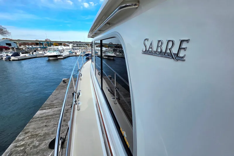  Yacht Photos Pics 2017 Sabre 42 Salon Express yacht docked at a marina under a clear blue sky.