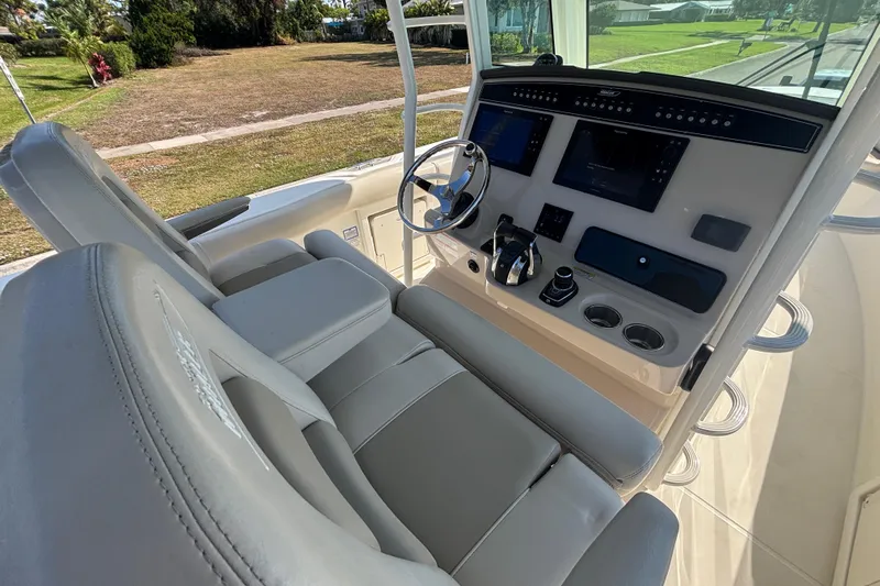  Yacht Photos Pics 2021 Boston Whaler 330 Outrage helm with modern controls and dual displays.