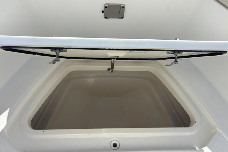  Yacht Photos Pics Open storage compartment on 2021 Boston Whaler 330 Outrage boat.