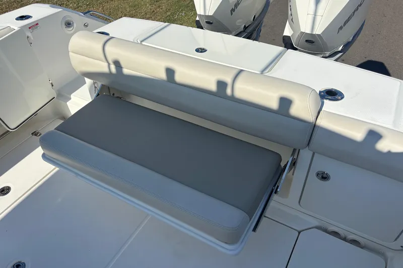  Yacht Photos Pics 2021 Boston Whaler 330 Outrage boat with cushioned seating and dual Mercury engines.