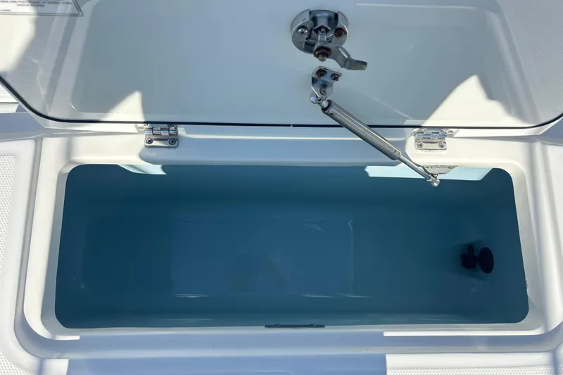  Yacht Photos Pics Open storage compartment on a 2021 Boston Whaler 330 Outrage boat.