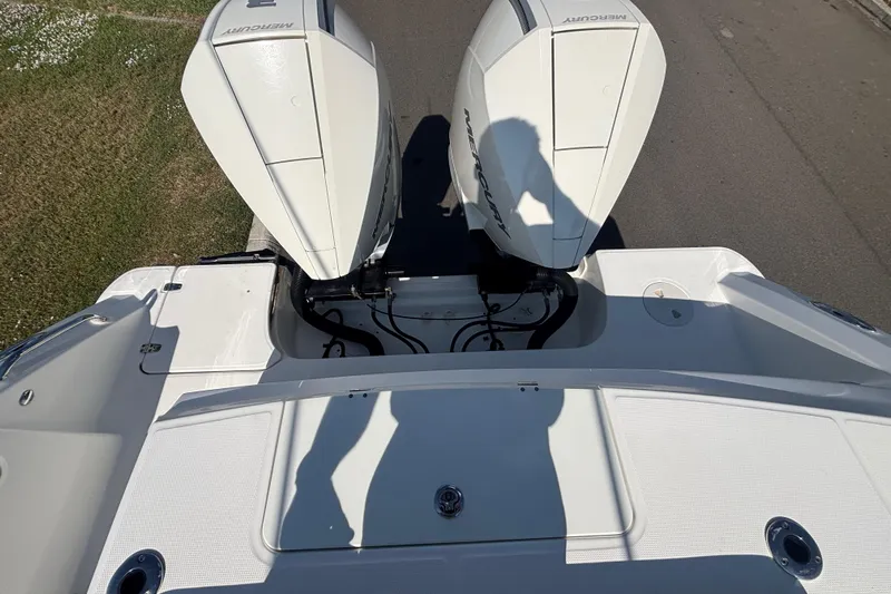  Yacht Photos Pics 2021 Boston Whaler 330 Outrage with dual Mercury outboard engines, viewed from above.