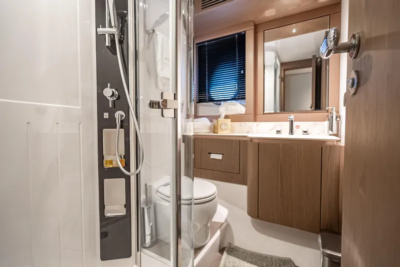 Triangle Of The Seas Yacht Photos Pics Luxurious bathroom interior of 2022 Azimut Magellano 66 yacht with modern fixtures.