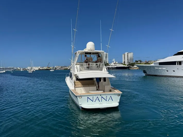 Nana Yacht Photos Pics Ocean Yachts 48 Convertible 2000 in marina, clear blue water, sunny day.