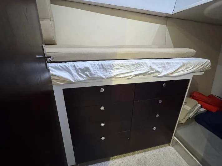 Nana Yacht Photos Pics Interior of 2000 Ocean Yachts 48 Convertible with storage drawers and bed.